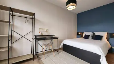 Un ou plusieurs lits dans un hébergement de l'établissement Les Appartements de Louis Spacieux-centre ville-mairie