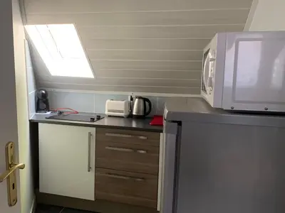 Cuisine ou kitchenette dans l'établissement Le Val Fleuri