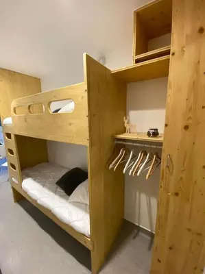 Un ou plusieurs lits dans un hébergement de l'établissement Le Lioran, La Sumène, Studio balcon tout confort aux pieds des pistes