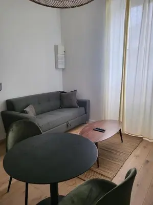 Coin salon dans l'établissement Appartement moderne calme et spacieux-Centre Thuillat
