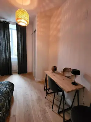 Coin salon dans l'établissement Appartement moderne calme et spacieux-Centre Thuillat