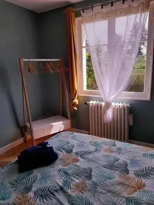 Un ou plusieurs lits dans un hébergement de l'établissement La maison aux volets bleus