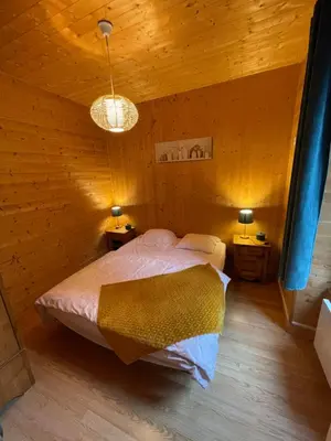 Un ou plusieurs lits dans un hébergement de l'établissement Appt lumineux centre ville du Mont Dore Vue Sancy