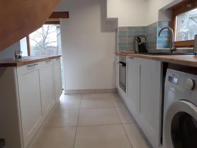 Cuisine ou kitchenette dans l'établissement La Vieille Maison aux Canards