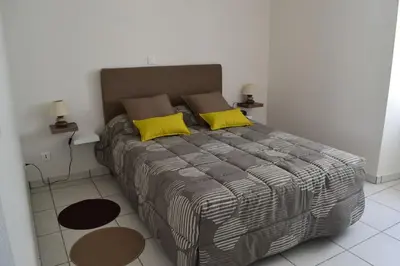 Un ou plusieurs lits dans un hébergement de l'établissement maison de vacances Nébouzat