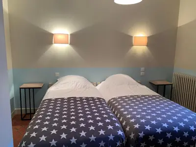 Un ou plusieurs lits dans un hébergement de l'établissement Charmant appartement jardin/parking privé 4 personnes