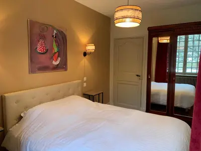 Un ou plusieurs lits dans un hébergement de l'établissement Charmant appartement jardin/parking privé 4 personnes