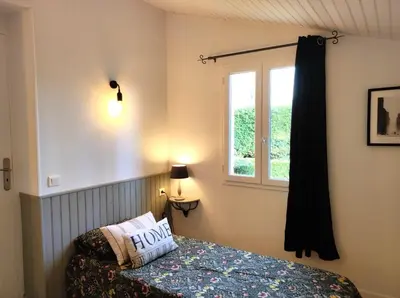 Un ou plusieurs lits dans un hébergement de l'établissement Les Jardins de Virginie