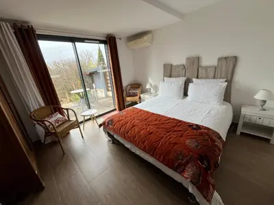 Un ou plusieurs lits dans un hébergement de l'établissement Les Etoiles de Calès - chambres d'hôtes de charme près de Rocamadour au coeur du Parc Naturel des Causses du Quercy
