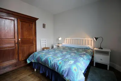 Un ou plusieurs lits dans un hébergement de l'établissement La ferme de lapeyrousse