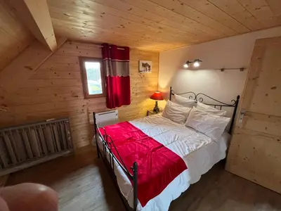 Un ou plusieurs lits dans un hébergement de l'établissement Chalet des Monts Dore