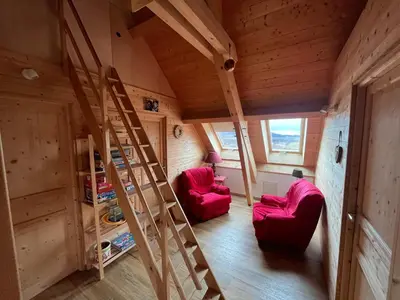 Coin salon dans l'établissement Chalet des Monts Dore