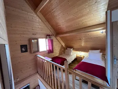 Un ou plusieurs lits dans un hébergement de l'établissement Chalet des Monts Dore