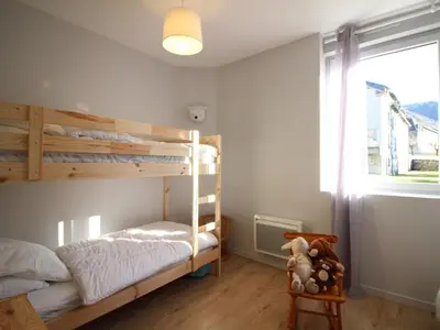 Un ou plusieurs lits dans un hébergement de l'établissement Bel appartement T3 au Mont-Dore avec parking et WiFi - FR-1-608-240