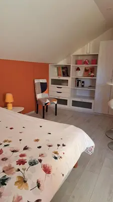 Un ou plusieurs lits dans un hébergement de l'établissement CHAMBRES D HÔTES CHEZ SYLVIE et Daniel