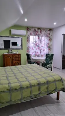 Un ou plusieurs lits dans un hébergement de l'établissement CHAMBRES D HÔTES CHEZ SYLVIE et Daniel