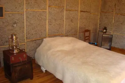 Un ou plusieurs lits dans un hébergement de l'établissement La cabane au bord de l'eau