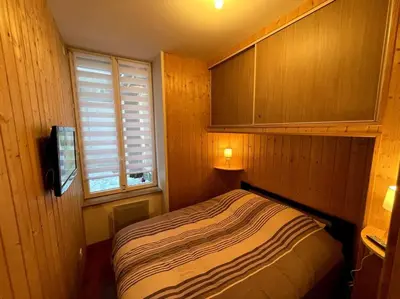 Un ou plusieurs lits dans un hébergement de l'établissement La Féessence boisée Le Mont Dore