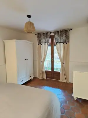 Un ou plusieurs lits dans un hébergement de l'établissement Maison de vacances à la campagne