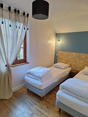 Un ou plusieurs lits dans un hébergement de l'établissement Maison de vacances à la campagne