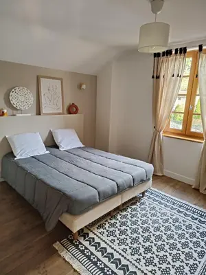 Un ou plusieurs lits dans un hébergement de l'établissement Maison de vacances à la campagne