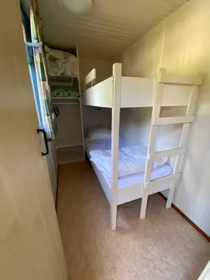 Un ou plusieurs lits dans un hébergement de l'établissement Cottage Rosa