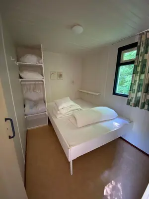 Un ou plusieurs lits dans un hébergement de l'établissement Cottage Rosa