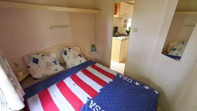 Un ou plusieurs lits dans un hébergement de l'établissement CAMPING LES PAILLOTES