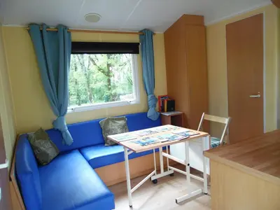 Coin salon dans l'établissement CAMPING LES PAILLOTES
