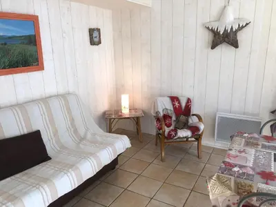 Coin salon dans l'établissement Le Mont Dore Résidence Cottage rez de chausse