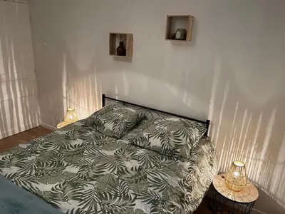 Un ou plusieurs lits dans un hébergement de l'établissement Villa La Butte, Appartements Chaleureux au Cœur de La Bourboule