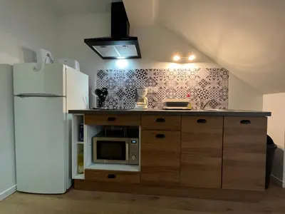 Cuisine ou kitchenette dans l'établissement Villa La Butte, Appartements Chaleureux au Cœur de La Bourboule