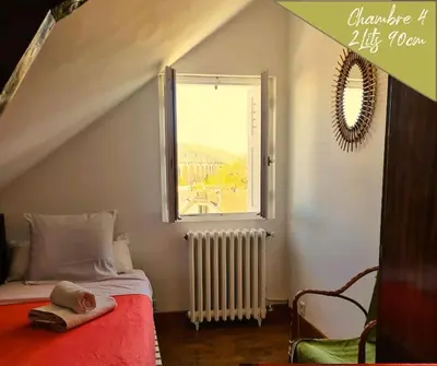 Un ou plusieurs lits dans un hébergement de l'établissement VILLA ANNEE 30 Rénovée ,Terrasse et Jardin