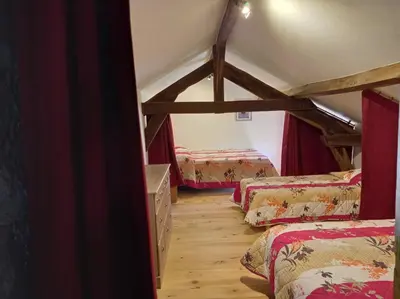 Un ou plusieurs lits dans un hébergement de l'établissement Chez Ophélie