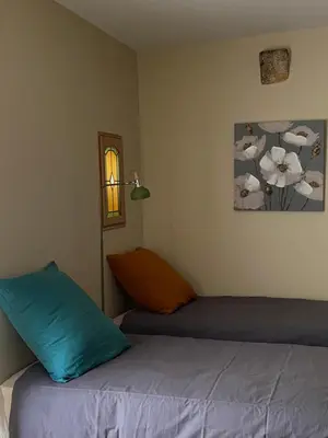 Un ou plusieurs lits dans un hébergement de l'établissement Le Moulin de la Maison des Templiers