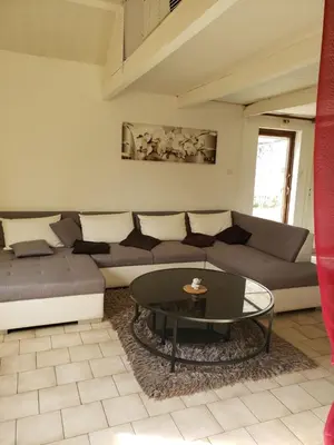 Coin salon dans l'établissement Gîte dans camping 4 étoiles