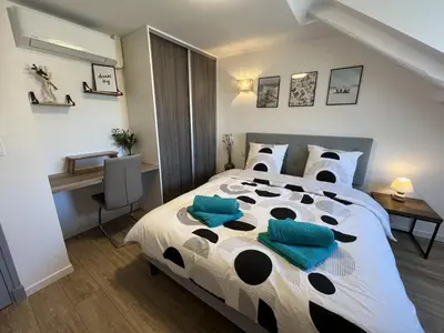 Un ou plusieurs lits dans un hébergement de l'établissement Nid douillet T2 rénové climatisé centre