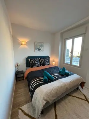 Un ou plusieurs lits dans un hébergement de l'établissement Charmant appartement T2 cosy climatisé