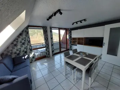 Coin salon dans l'établissement Appartement T2 45m2 avec terrasse - 4 personnes