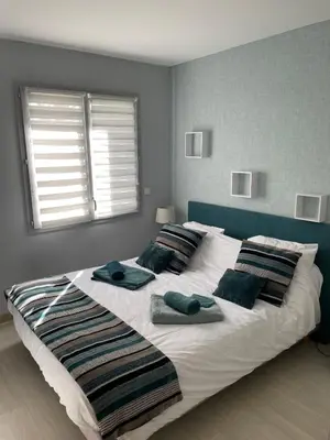 Un ou plusieurs lits dans un hébergement de l'établissement La Maison de l'Auzette