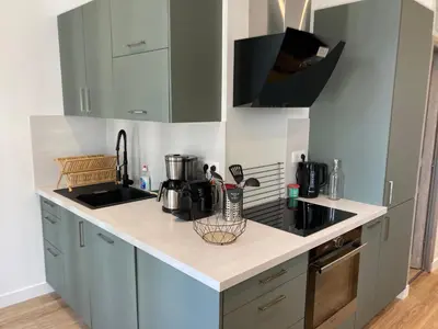 Cuisine ou kitchenette dans l'établissement Les balcons du Sancy - Appartement neuf 3 étoiles