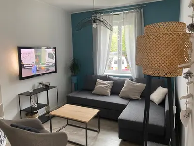 Télévision ou salle de divertissement dans l'établissement Maison de ville