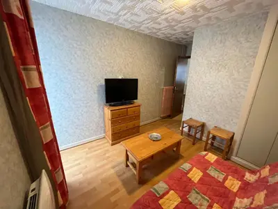 Télévision ou salle de divertissement dans l'établissement Altitude Location Montagne