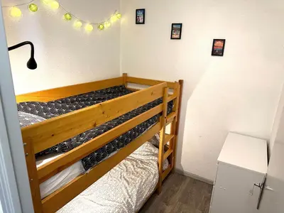 Un ou plusieurs lits dans un hébergement de l'établissement Appartement cosy Centre station de Super Besse pour 2 à 6 personnes