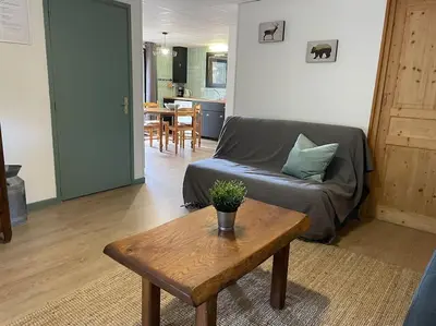 Coin salon dans l'établissement Appartement 4 personnes - CHALET COSY Mont Dore