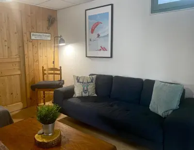 Coin salon dans l'établissement Appartement 4 personnes - CHALET COSY Mont Dore
