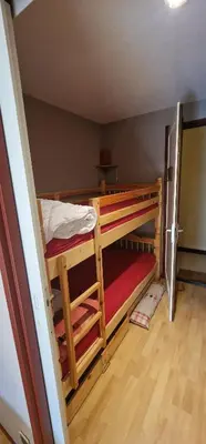 Un ou plusieurs lits dans un hébergement de l'établissement Appartement 4/6 le lioran