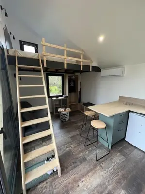 Un ou plusieurs lits superposés dans un hébergement de l'établissement Tiny House L’œil des Dômes