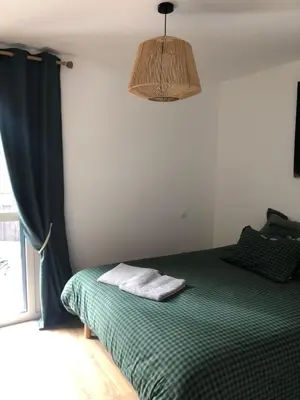 Un ou plusieurs lits dans un hébergement de l'établissement APPARTEMENT AUX PIEDS DES PISTES DE SKI