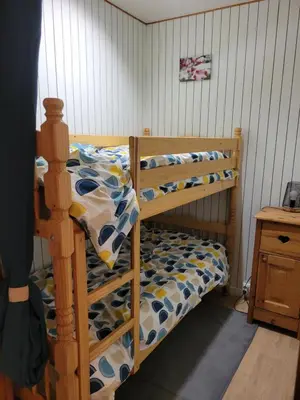 Un ou plusieurs lits dans un hébergement de l'établissement Studio cabine la Foret au plus près des pistes 36m2